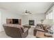 Comfortable living room with a fireplace, plush leather furniture, and neutral decor at 216 Captain Harbor Hbr, Sanford, NC 27332