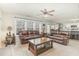Spacious living room with plush leather seating and an open floor plan to the kitchen at 216 Captain Harbor Hbr, Sanford, NC 27332