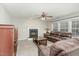 Comfortable living room with a fireplace, plush leather furniture, and neutral decor at 216 Captain Harbor Hbr, Sanford, NC 27332