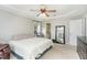 Bedroom features a tray ceiling, ceiling fan, and large mirror near the doorway at 216 Captain Harbor Hbr, Sanford, NC 27332
