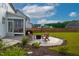 Backyard patio with Adirondack chairs around a fire pit, perfect for outdoor entertaining and relaxation at 226 Castle Pond Way, Fuquay Varina, NC 27526