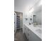 Modern bathroom with double sinks, quartz countertops, and a separate toilet room, offering convenience and style at 226 Castle Pond Way, Fuquay Varina, NC 27526