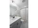 Bathroom with a shower and tub combo, neutral walls, and a framed decorative print above the toilet at 226 Castle Pond Way, Fuquay Varina, NC 27526