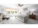 Well-lit bedroom with a large window, plush carpet, and neutral-colored walls and decor at 226 Castle Pond Way, Fuquay Varina, NC 27526