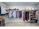 Spacious walk-in closet with ample shelving and hanging space, perfect for organizing clothes and accessories at 226 Castle Pond Way, Fuquay Varina, NC 27526