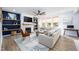 Bright living room featuring a fireplace, built-in shelving, neutral color palette, and stylish decor at 226 Castle Pond Way, Fuquay Varina, NC 27526