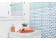 Bathroom vanity featuring an orange sink, new fixtures, and neutral decor at 2523 Glendale Ave, Durham, NC 27704