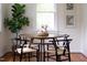 A cozy dining area with a round table, comfortable seating, and bright natural light at 2523 Glendale Ave, Durham, NC 27704