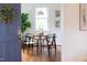 Charming dining room with modern lighting, stylish chairs, and hardwood floors at 2523 Glendale Ave, Durham, NC 27704