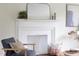Elegant fireplace with decorative mantle, mirror, and stylish accents at 2523 Glendale Ave, Durham, NC 27704