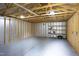 Unfinished garage interior featuring open stud bay walls and concrete floor at 2523 Glendale Ave, Durham, NC 27704