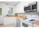 Cozy kitchen with butcher block countertops and stainless steel appliances at 2523 Glendale Ave, Durham, NC 27704