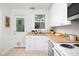 Bright and clean kitchen boasts butcher block countertops and stainless steel appliances at 2523 Glendale Ave, Durham, NC 27704