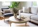 Bright living room showing modern decor, a stylish sofa, and a round coffee table at 2523 Glendale Ave, Durham, NC 27704
