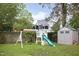 The backyard features a play structure with swings and a slide, plus a small storage building at 2523 Glendale Ave, Durham, NC 27704