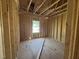 Inside the framed bedroom with window showing the initial construction phase and layout at 267 Meadowbark Bnd # 34, Garner, NC 27529