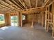 Exposed framing of a living room with windows and glass door, offering natural light and views to the outdoors at 267 Meadowbark Bnd # 34, Garner, NC 27529