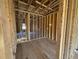 Unfinished room shows the framework, window openings, and layout details, revealing the construction phase at 267 Meadowbark Bnd # 34, Garner, NC 27529