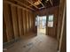 Framed flex space ready for drywall with door leading to the backyard at 268 Meadowbark Bnd # 42, Garner, NC 27529