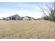 Large backyard featuring newly installed sod, offering a blank canvas for landscaping and outdoor activities at 287 South Breeze Way, Fuquay Varina, NC 27526