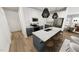Modern kitchen with white cabinets, stainless steel appliances, and a large island with barstool seating at 2922 Alyssa Ct, Raleigh, NC 27604