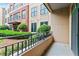 Balcony with black metal railing and view of landscaped lawn and building at 300 Finsbury St # 109, Durham, NC 27703