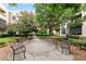 Beautiful community courtyard with landscaping and benches at 300 Finsbury St # 109, Durham, NC 27703