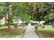 Landscaped courtyard with benches and walking path at 300 Finsbury St # 109, Durham, NC 27703