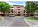 Beautiful brick building with a professionally landscaped exterior, parking, and green spaces at 300 Finsbury St # 109, Durham, NC 27703