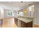 Open kitchen featuring stainless steel appliances, granite countertops, and natural light, overlooking living area at 300 Finsbury St # 109, Durham, NC 27703
