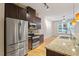Well-equipped kitchen with stainless steel appliances, granite countertops, and modern cabinetry at 300 Finsbury St # 109, Durham, NC 27703