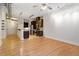 Spacious living area with hardwood floors, leading into kitchen with stainless appliances and granite countertops at 300 Finsbury St # 109, Durham, NC 27703