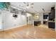 Open-concept living area with hardwood floors leading into the kitchen with an island at 300 Finsbury St # 109, Durham, NC 27703