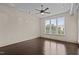 A modern bedroom featuring hardwood floors, a ceiling fan, and track lighting at 300 Finsbury St # 309, Durham, NC 27703