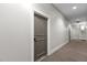 Hallway with carpet and door at 300 Finsbury St # 309, Durham, NC 27703