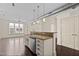 Well-equipped kitchen island features a sink, dishwasher, granite countertops, and ample storage at 300 Finsbury St # 309, Durham, NC 27703