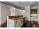 Bright kitchen island with granite countertops and stainless appliances in modern home at 300 Finsbury St # 309, Durham, NC 27703