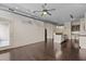 Open-concept living room with hardwood floors and modern lighting at 300 Finsbury St # 309, Durham, NC 27703