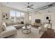 Bright living room featuring a modern sofa, decorative accessories, and natural light at 300 Finsbury St # 309, Durham, NC 27703