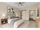 Cozy bedroom featuring a ceiling fan, ensuite bathroom, and ample natural light at 300 Finsbury St # 309, Durham, NC 27703