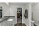 Granite countertop in bathroom with walk in closet and toilet at 301 Sawgrass Ct, Mebane, NC 27302