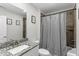 Full bathroom with modern fixtures and patterned shower curtain at 301 Sawgrass Ct, Mebane, NC 27302