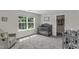 Bedroom room with gray crib near window and closet at 301 Sawgrass Ct, Mebane, NC 27302
