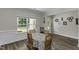 Bright dining room featuring a window, modern decor, and views of the front yard at 301 Sawgrass Ct, Mebane, NC 27302