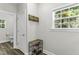Entryway with shoe rack and coat hooks at 301 Sawgrass Ct, Mebane, NC 27302