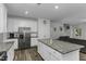Bright, open kitchen with a large center island, stainless appliances, and wooden floors at 301 Sawgrass Ct, Mebane, NC 27302