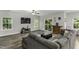 This inviting living room showcases a walkout, backyard view, and a comfy sectional sofa at 301 Sawgrass Ct, Mebane, NC 27302