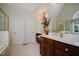 Bright bathroom features double vanities and a separate glass-enclosed shower at 3021 Glenwood Dr, Durham, NC 27705