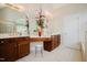 Bright bathroom featuring double vanities, a makeup area, and ample natural light at 3021 Glenwood Dr, Durham, NC 27705