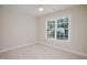 Bedroom featuring carpet, natural light, and neutral paint at 3021 Glenwood Dr, Durham, NC 27705